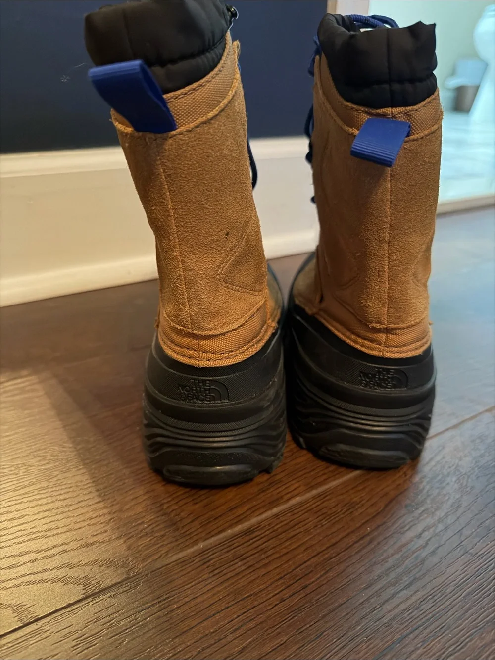 The North Face Kids Brown and Black Waterproof Snow Boots with Blue Laces